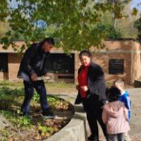 kinder students planting natives at Shawmut Hills sycamore circle mural site